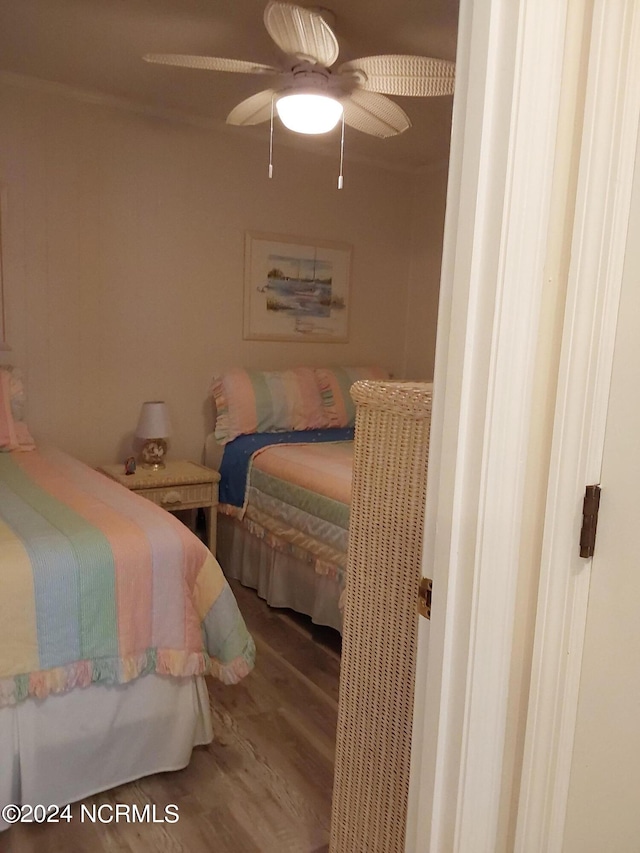 bedroom featuring wood-type flooring and ceiling fan