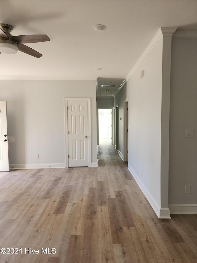 spare room with crown molding, ceiling fan, and hardwood / wood-style flooring