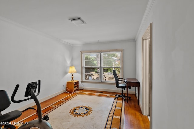 office space with crown molding and hardwood / wood-style flooring