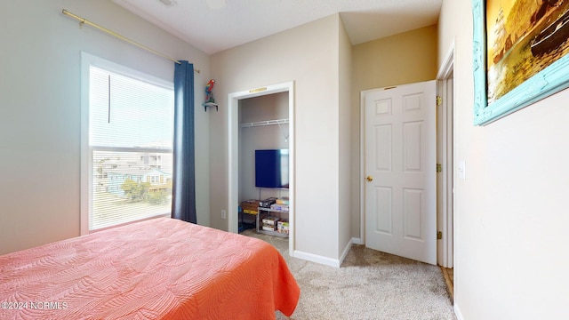 carpeted bedroom featuring a closet