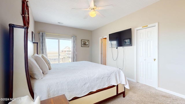 carpeted bedroom featuring ceiling fan