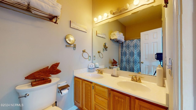 bathroom with toilet and vanity