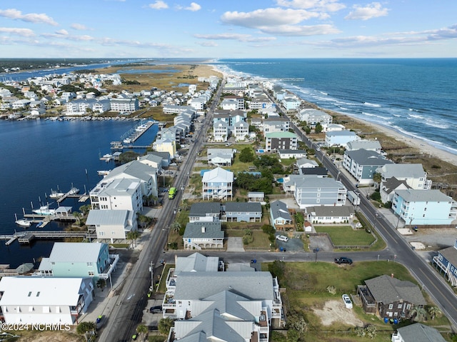 drone / aerial view with a water view and a view of the beach