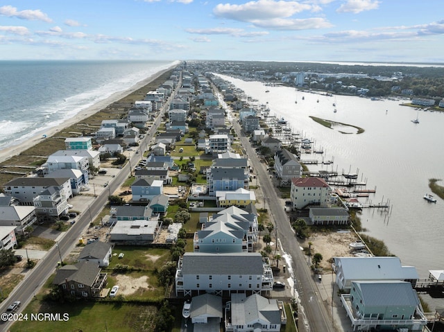 aerial view with a water view and a view of the beach