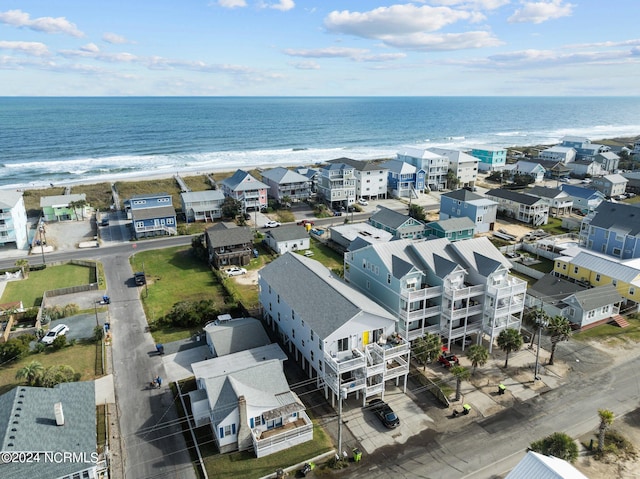 bird's eye view featuring a view of the beach and a water view