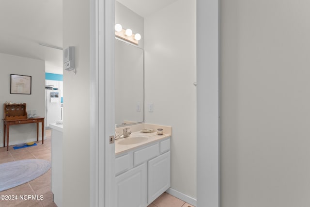 bathroom with tile patterned floors and vanity