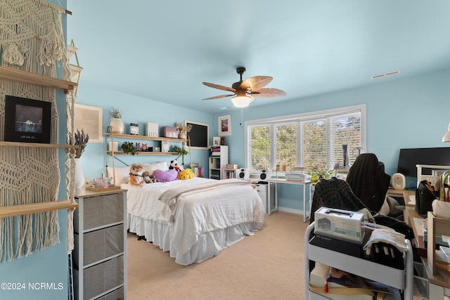 carpeted bedroom featuring ceiling fan