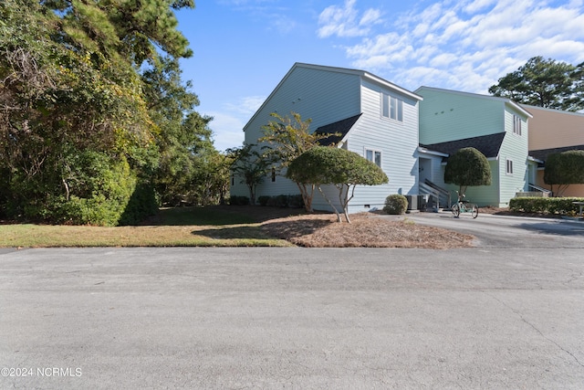 view of home's exterior with central AC