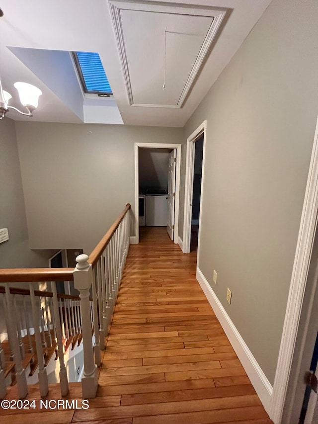 corridor with light hardwood / wood-style flooring