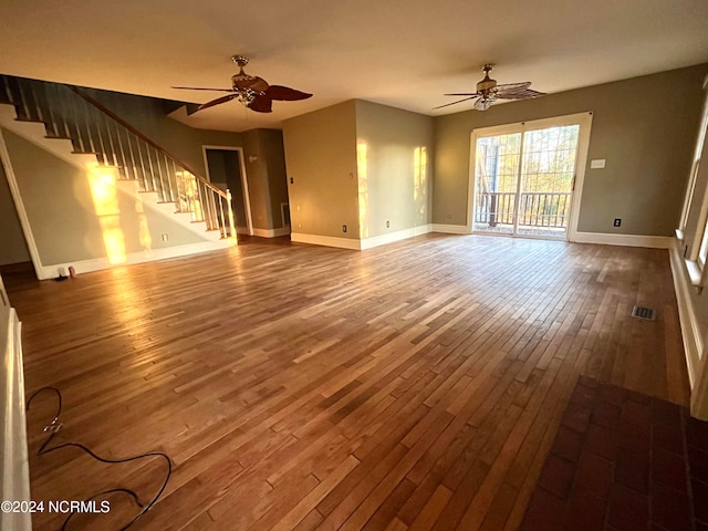 unfurnished living room with ceiling fan and wood-type flooring