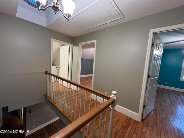 stairs featuring hardwood / wood-style flooring