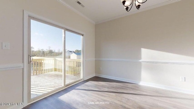 unfurnished dining area featuring an inviting chandelier, dark hardwood / wood-style floors, and ornamental molding