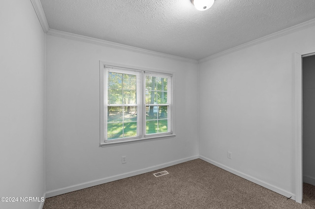 carpeted spare room featuring a textured ceiling and ornamental molding