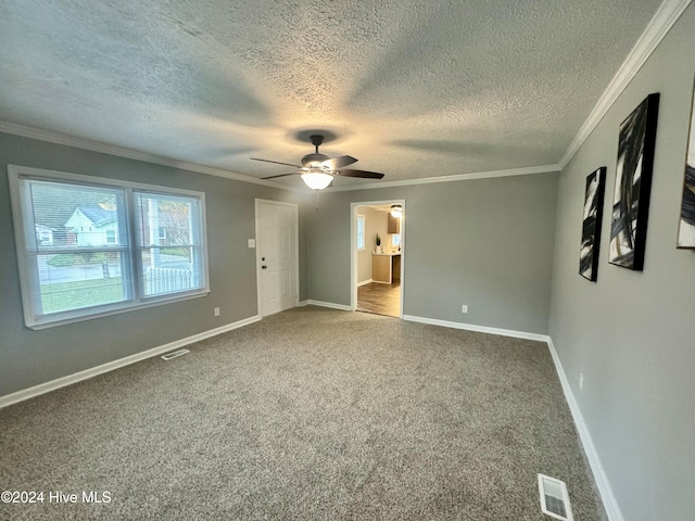 unfurnished bedroom with ceiling fan, carpet, and a textured ceiling