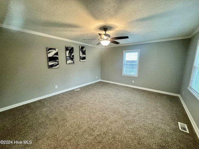 carpeted spare room with a textured ceiling, ceiling fan, and crown molding