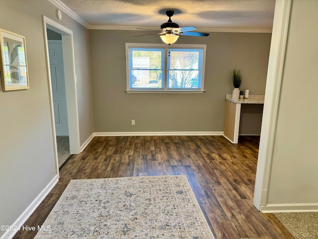 unfurnished room with hardwood / wood-style floors, ceiling fan, ornamental molding, and a textured ceiling