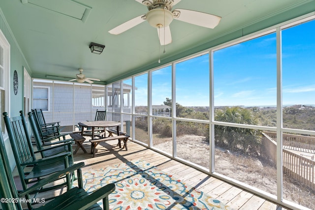 sunroom / solarium with ceiling fan