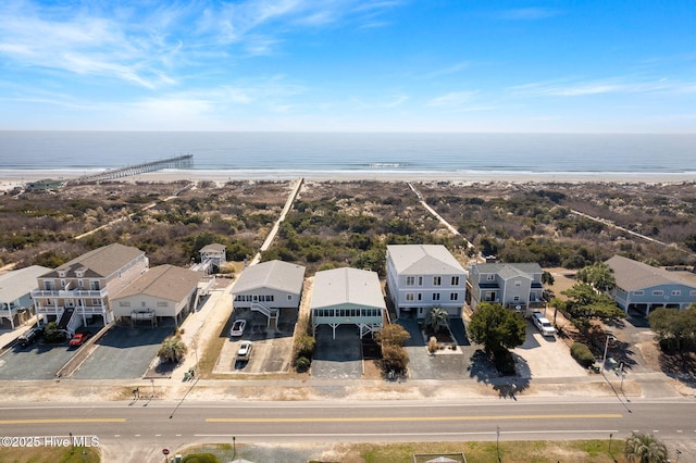 bird's eye view featuring a water view, a residential view, and a view of the beach