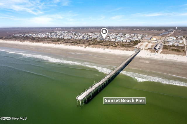 aerial view featuring a water view and a beach view