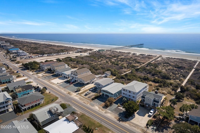 birds eye view of property featuring a water view and a view of the beach