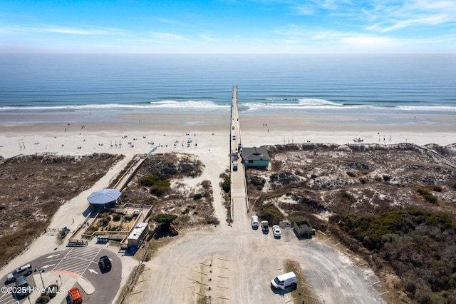 aerial view with a water view and a view of the beach