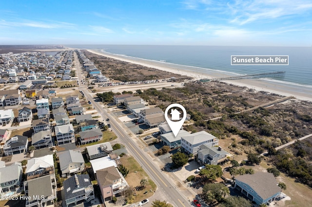 bird's eye view with a beach view and a water view