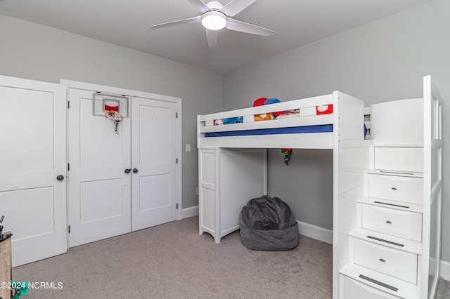 unfurnished bedroom featuring ceiling fan and light colored carpet