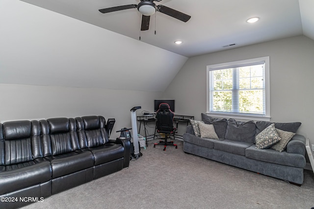 carpeted living room featuring ceiling fan and lofted ceiling