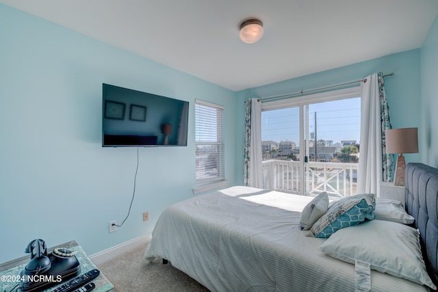 bedroom featuring light carpet