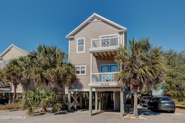 exterior space featuring a carport and a balcony