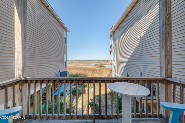 wooden terrace featuring central AC unit