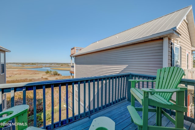 wooden terrace with a water view