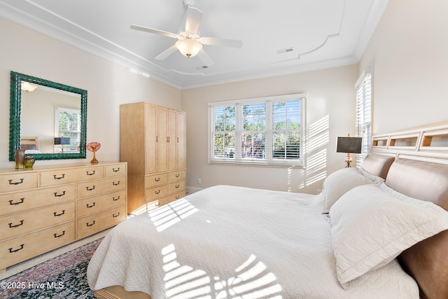 bedroom with crown molding and ceiling fan