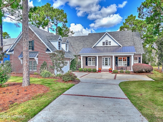 view of front facade featuring a front lawn and a porch