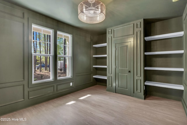 unfurnished bedroom featuring wood finished floors