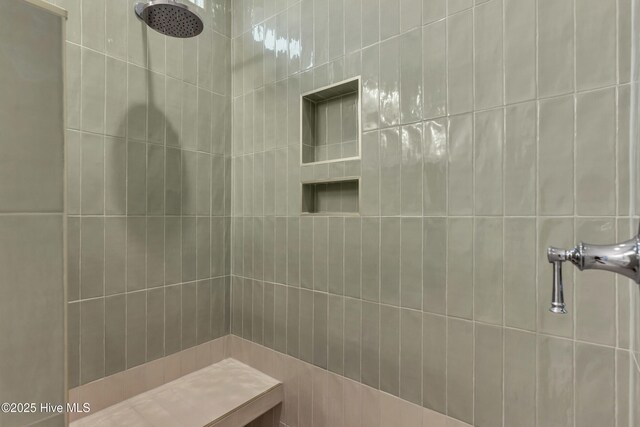 full bathroom with tiled shower