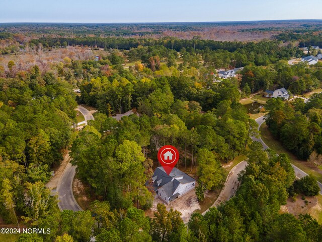 aerial view with a wooded view