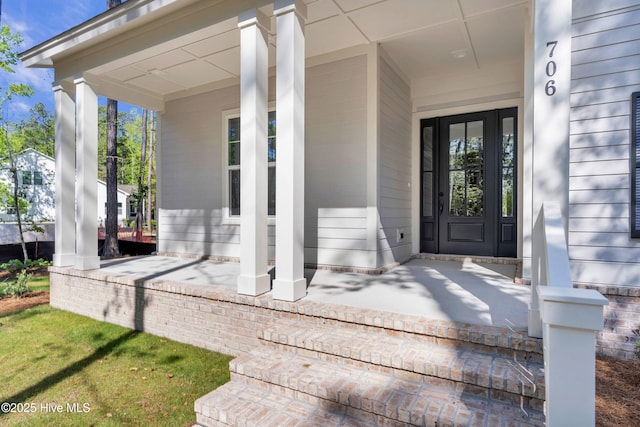 doorway to property featuring a porch
