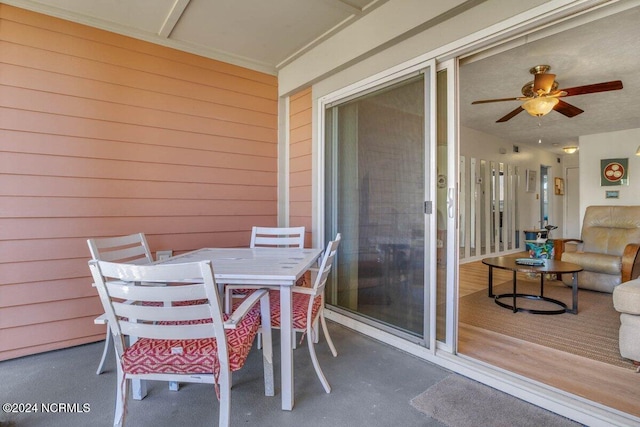 balcony featuring a patio area and ceiling fan