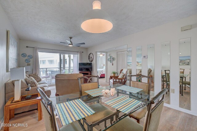 1000 Caswell Beach Rd Unit 1111, Oak Island, NC 28465 - dining area featuring light wood-type flooring, a textured ceiling, and a ceiling fan