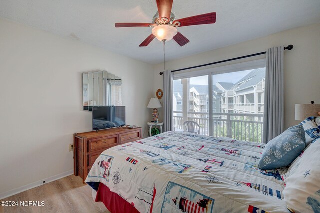 bedroom with ceiling fan, light wood-type flooring, and access to exterior