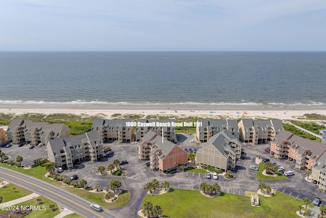 1000 Caswell Beach Rd Unit 1111, Oak Island, NC 28465 - aerial view of waterfront with a beach and apartment complex