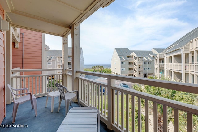 1000 Caswell Beach Rd Unit 1111, Oak Island, NC 28465 - balcony with a water view and a residential view