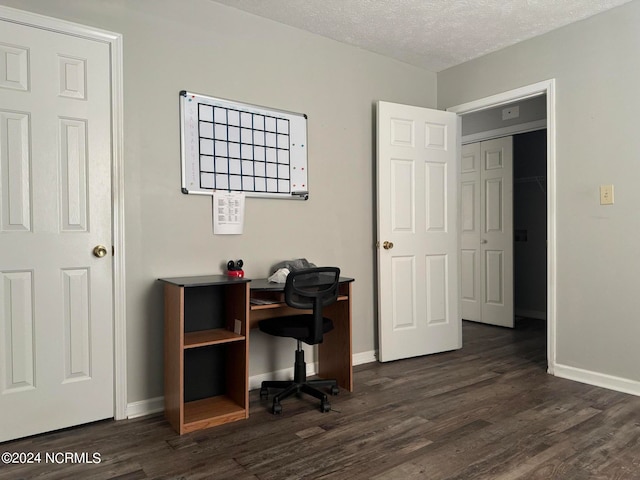 office space featuring a textured ceiling and dark hardwood / wood-style floors