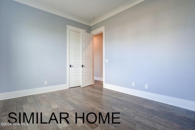187 Spicer Lake Dr, Holly Ridge, NC 28445 - spare room with ornamental molding, baseboards, and wood finished floors