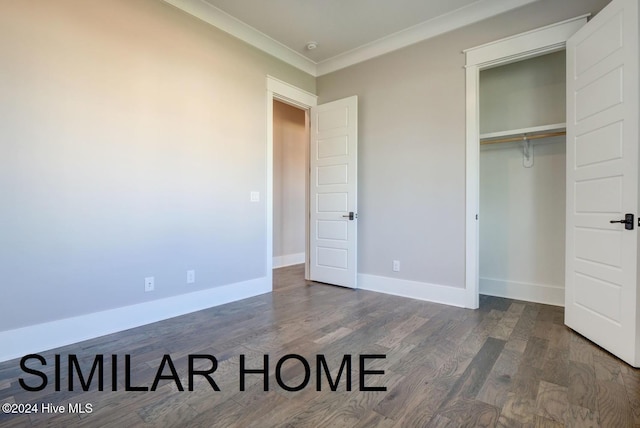 187 Spicer Lake Dr, Holly Ridge, NC 28445 - unfurnished bedroom featuring crown molding, baseboards, a closet, and wood finished floors