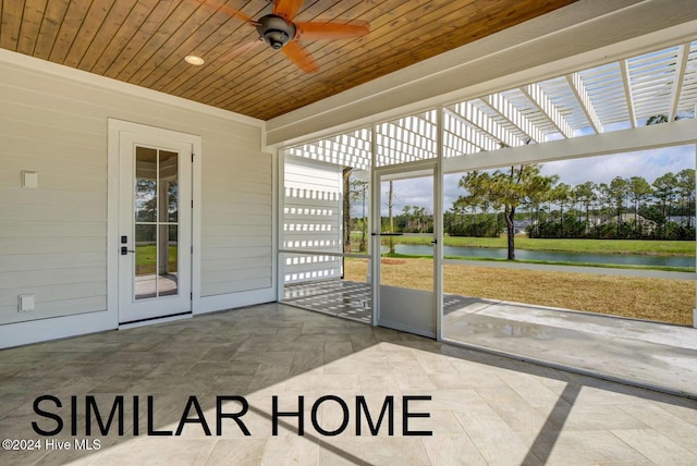 187 Spicer Lake Dr, Holly Ridge, NC 28445 - sunroom featuring a ceiling fan and a water view