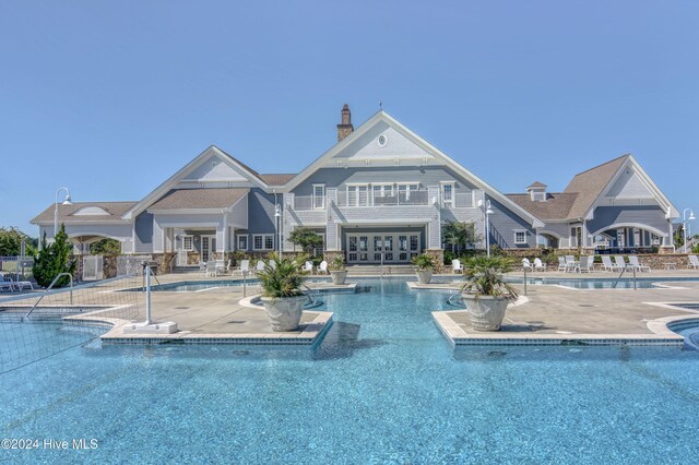 community pool with a patio area