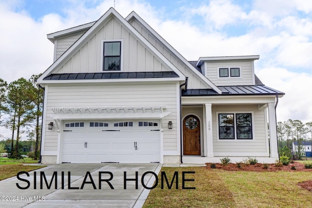 modern inspired farmhouse with a garage, driveway, a standing seam roof, a front lawn, and board and batten siding