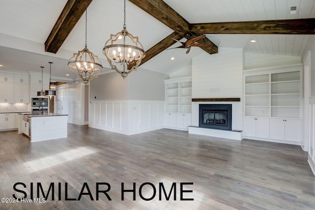 187 Spicer Lake Dr, Holly Ridge, NC 28445 - unfurnished living room featuring recessed lighting, a chandelier, a large fireplace, vaulted ceiling with beams, and wood finished floors